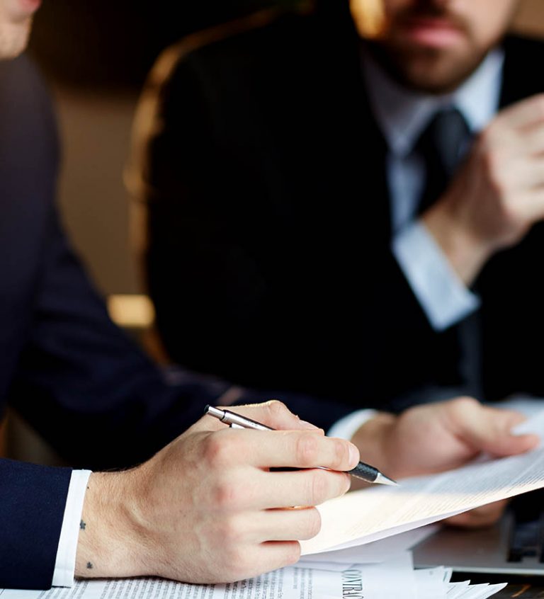Employment law consultant reviewing a contract with a client